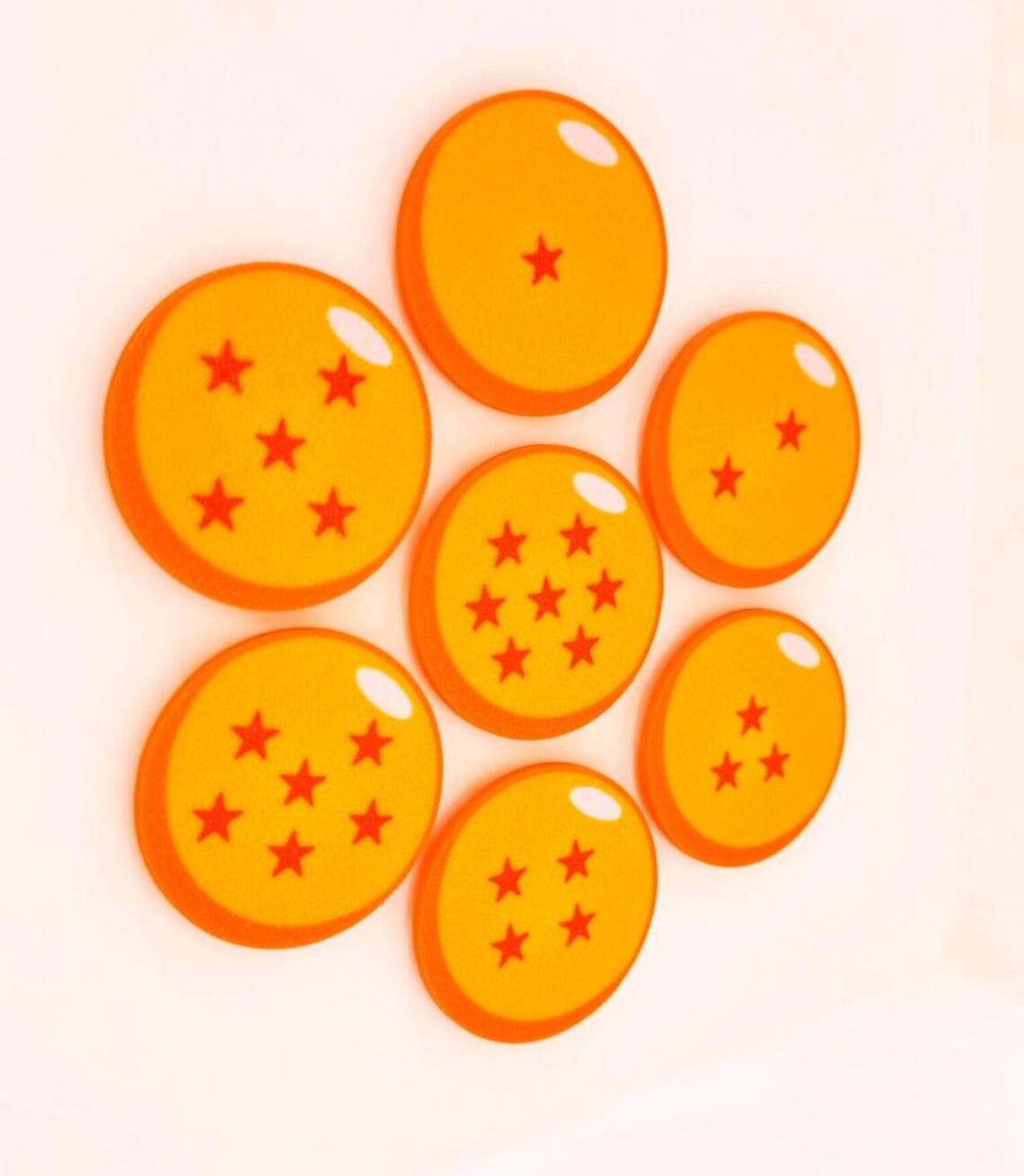 A set of glossy orange lucky star ball magnets arranged in rows