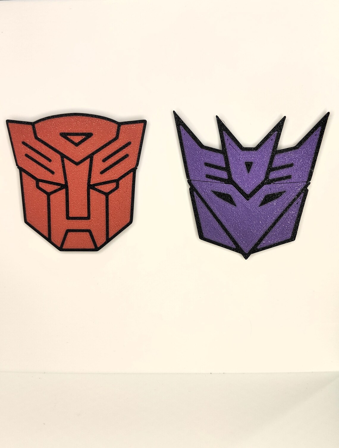A split Transformers magnet set photographed on a white background